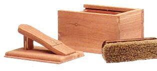 Cedar shoe trees on a wooden surface